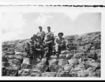 "Tony, Mac, Crider, Elles, Kirby, Joe, on dam at falls."  A dam and and falls about 8 miles southeast of the Luliang air base area in Yunnan province, China, where the GIs went to swim and relax. During WWII.