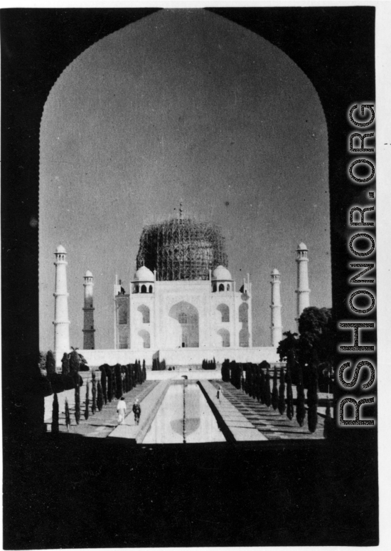 Taj Mahal under repair.  Scenes in India witnessed by American GIs during WWII. For many Americans of that era, with their limited experience traveling, the everyday sights and sounds overseas were new, intriguing, and photo worthy.