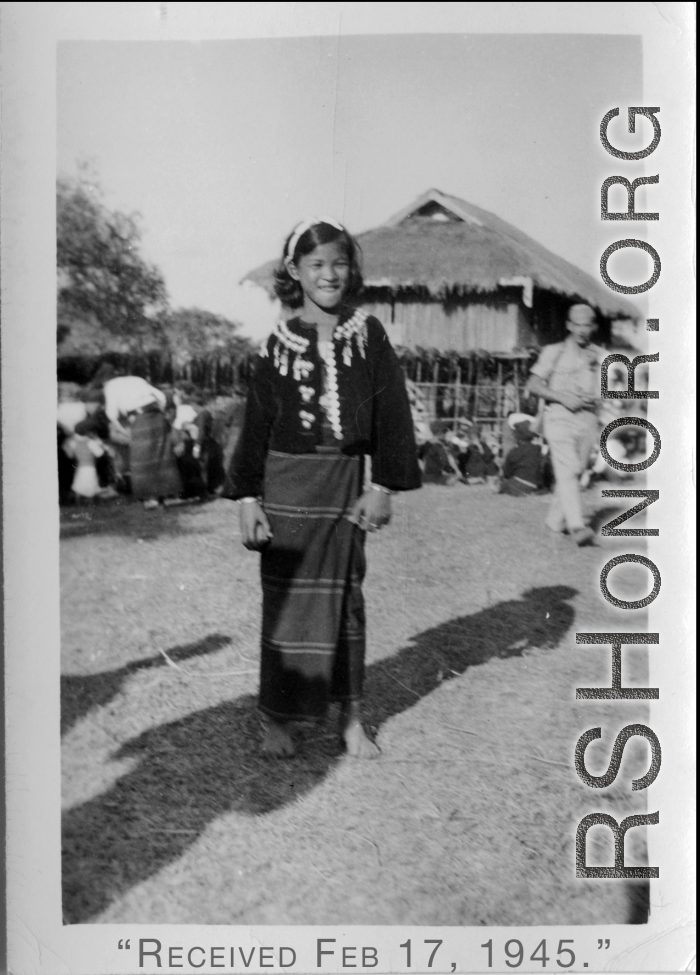 Local people in Burma near the 797th Engineer Forestry Company--A Kachin girl dress for Christmas on December 25, 1944, in Burma.  During WWII.