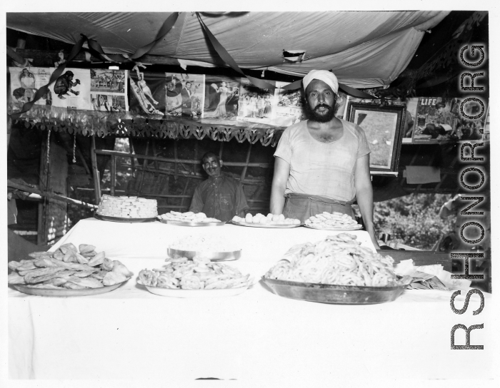 Men vending food in Burma or India.  Near the 797th Engineer Forestry Company.  During WWII.