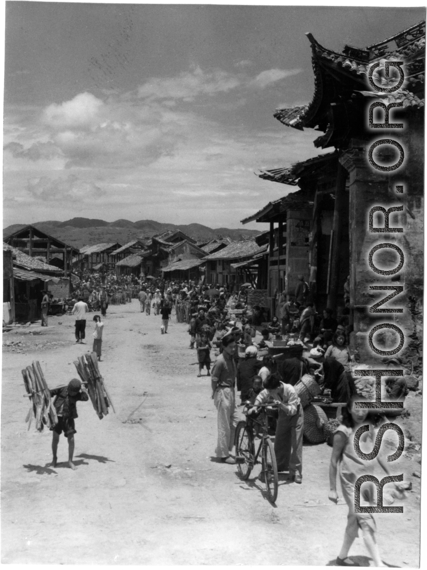 A village in SW China, on market day. In the CBI during WWII. 