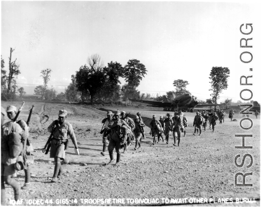 Chinese troops retire to Bivouac in Burma to await other planes. Burma. December 10, 1944. 10th Air Force.