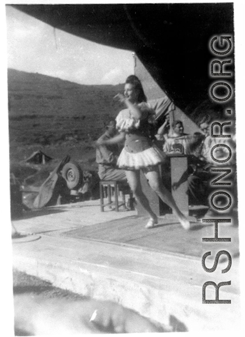 A woman dances for the troops in the CBI during WWII.