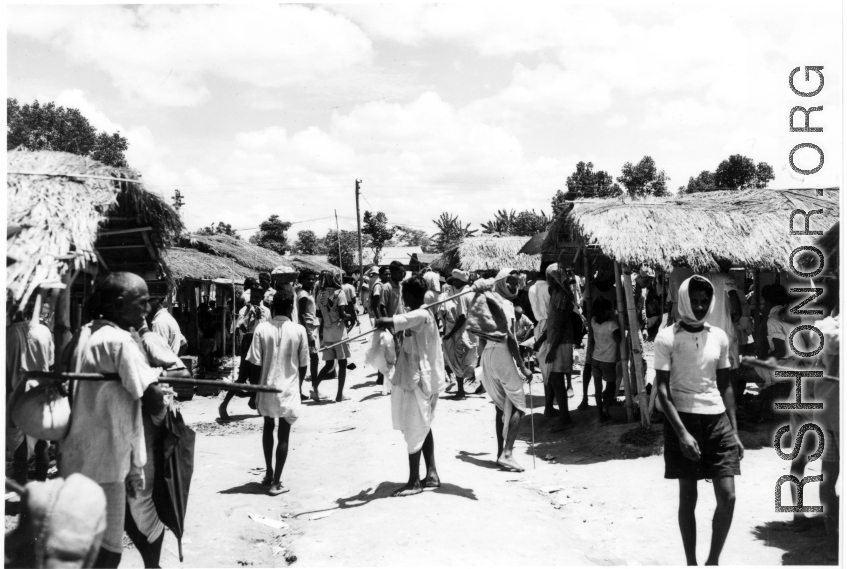 A market in India (or Burma) on a hot day during WWII.