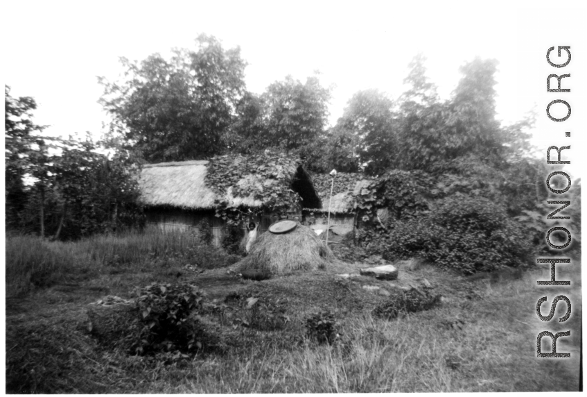 A village scene in India, with a small child in the middle.  Local images provided to Ex-CBI Roundup by "P. Noel" showing local people and scenes around Misamari, India.    In the CBI during WWII.