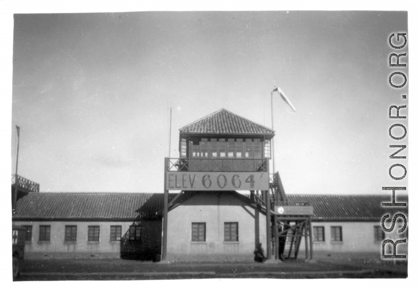 "This is the control tower at Luliang, China. It was at the highest elevation of any base we were at in China. We were at 6000 feet and we had snow here. The only base I can remember that had snow."  6064' elevation.