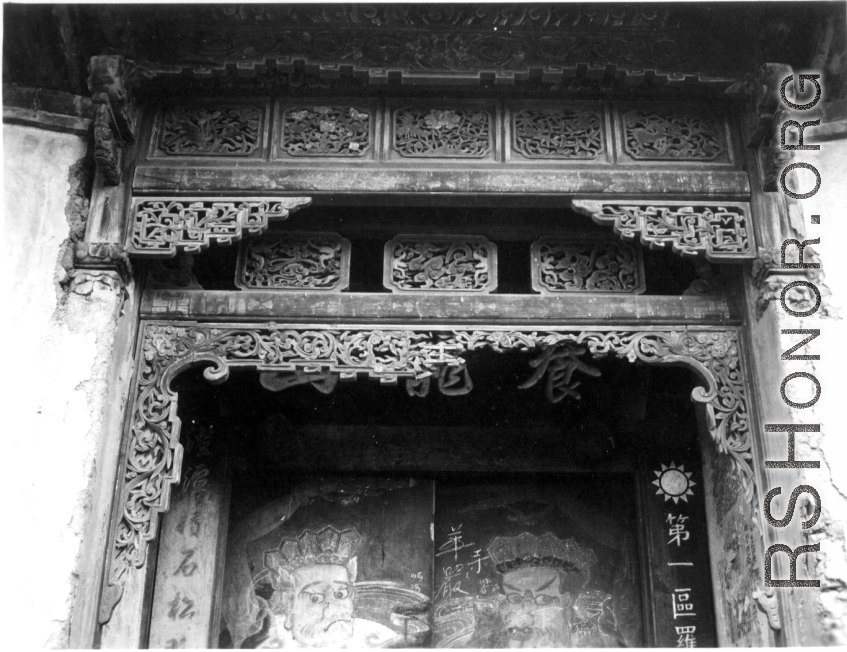 An ornate wooden surround for a doorway in China, for a building/courtyard taken over by Nationalist military or government. During WWII.  From the collection of Frank Bates.