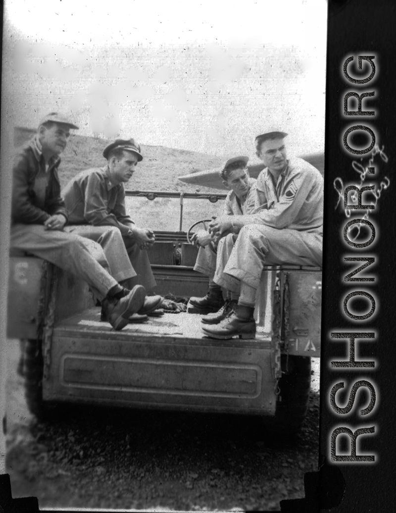 Servicemen out near the flight line"loading bombs" in SW China during WWII, mostly likely in Yunnan.