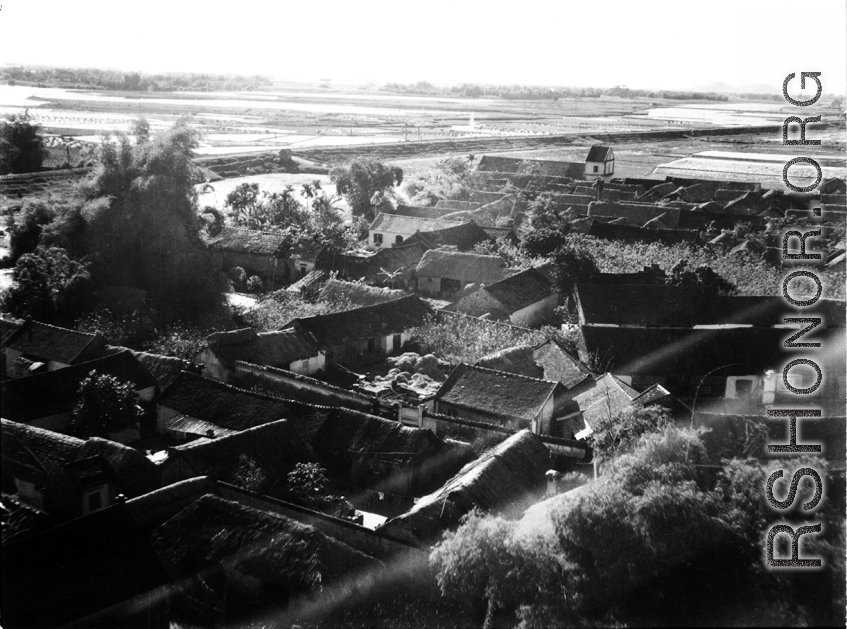 A village as seen from a B-25 flying at extremely low and dangerous treetop level in French Indochina. During WWII.