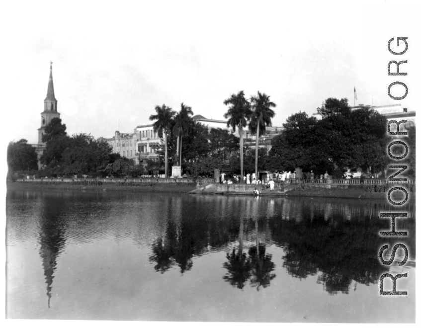 Buildings on waterfront.  Scenes in India witnessed by American GIs during WWII. For many Americans of that era, with their limited experience traveling, the everyday sights and sounds overseas were new, intriguing, and photo worthy.