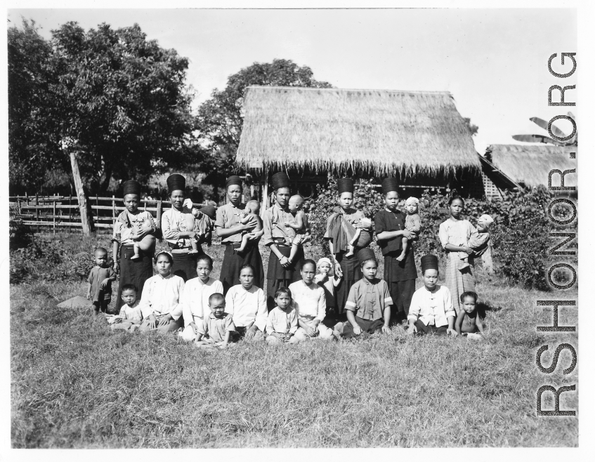 Local people in Burma near the 797th Engineer Forestry Company--women and children pose.  During WWII.
