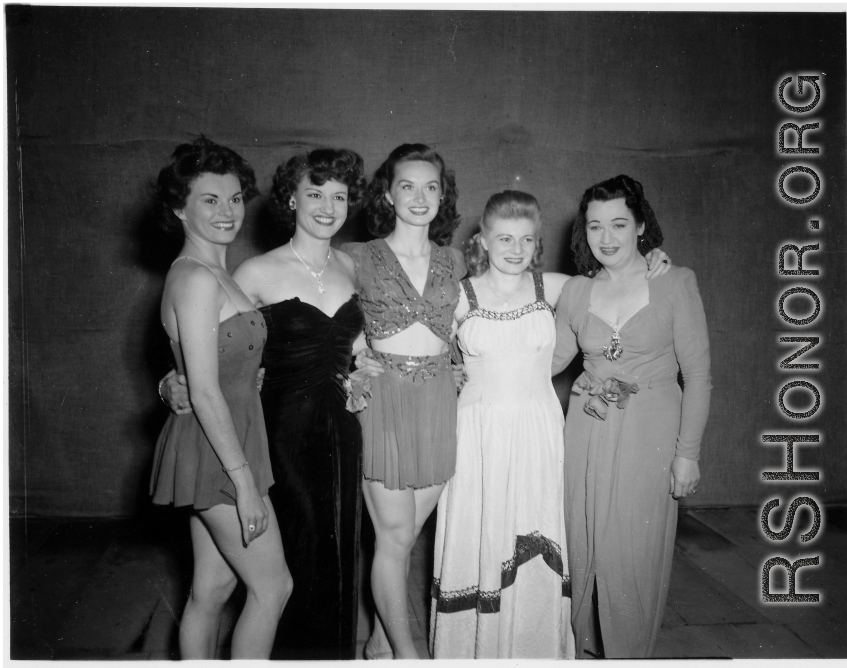 Performers well off the beaten track, USO performers visit the Burma Road engineers of the 797th Engineer Forestry Company.  During WWII.