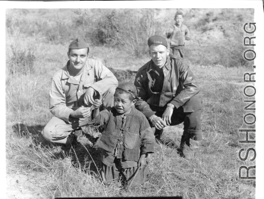 American flyers and Chinese boy at Chanyi (Zhanyi), during WWII.