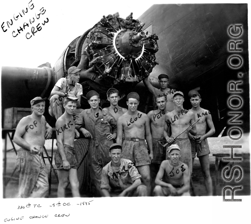 Engine change crew work on a C-47 transport plane in the CBI. 330th Troop Carrier, 9th CC. 1945.  Sergeant Arnold Wall in far back against the fuselage. 