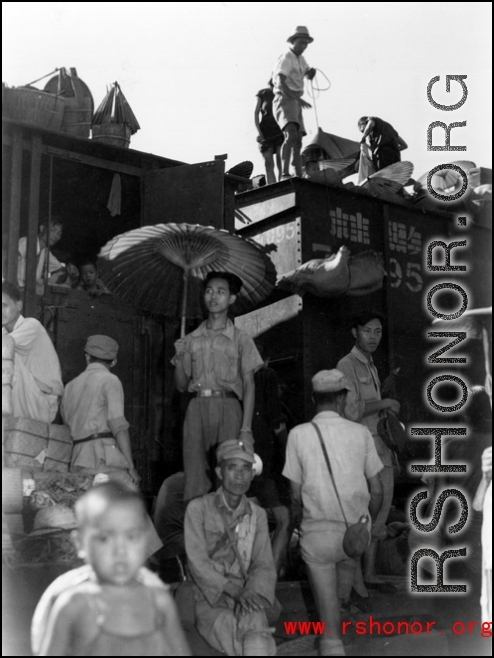 Chinese wait at the train station in Liuzhou during WWII, in the fall of 1944, as the Japanese advanced during the Ichigo campaign.