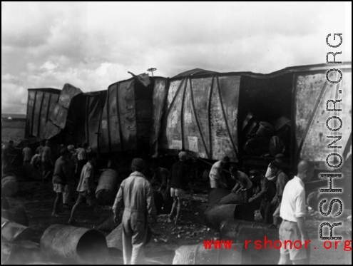 Allied gas train at the edge of the field, Liuzhou (Luichow), China Sept 1944, after a Japanese bombing raid, during WWII.