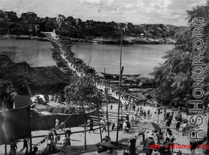 Looking north across the floating bridge at Liuzhou city, Guangxi province, China, near the US Airbase during the Second World War.  Selig Seidler was a member of the 16th Combat Camera Unit in the CBI during WWII.