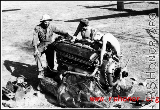 Engineers unwrap and prep a new engine in the CBI during WWII.