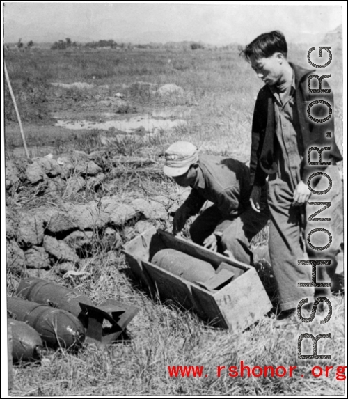 Workers in China unbox aerial bombs in the CBI during WWII. 