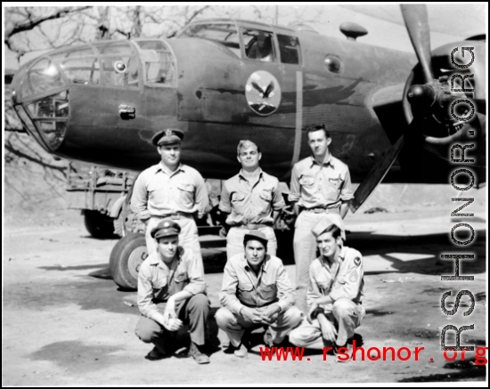 Crew standing before a B-25 bomber. In the CBI during WWII.