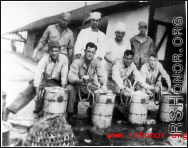 GIs hand-crank barrels of ice cream in the CBI during WWII.