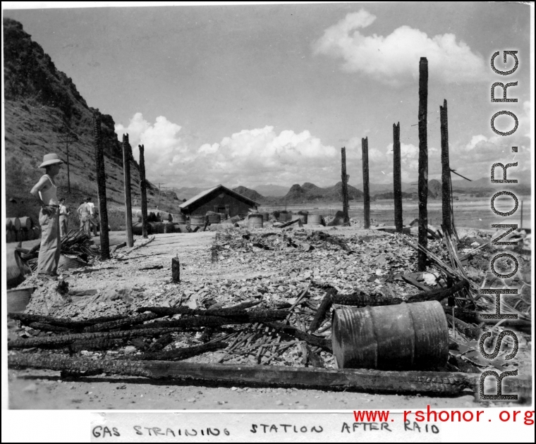 Gas straining station after Japanese air raid. Karst hills in the background hit that this is likely a US base in Guangxi province, China, either at Liuzhou or Guilin.