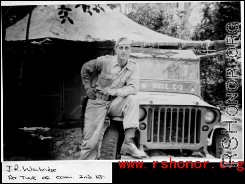 2nd Lt. J. R. Walridge leaning on jeep in the CBI, during WWII.