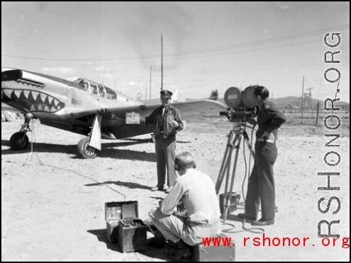 An American GI being filmed in front of a P-51. From the collection of Hal Geer.