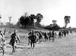 Chinese troops retire to Bivouac in Burma to await other planes. Burma. December 10, 1944. 10th Air Force.