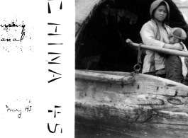 A Chinese woman nurses a baby in a boat on a canal in Kunming during WWII, May 1945.