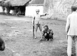 A beggar and a soldier, China, during WWII.  From the collection of Wozniak, combat photographer for the 491st Bomb Squadron, in the CBI.
