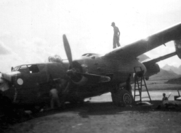 A B-25 after crashing in southern China, in Guangxi province, being salvaged.