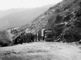 Rest break on the Burma Road, possibly to gawk at a crash or some curiosity. During WWII.