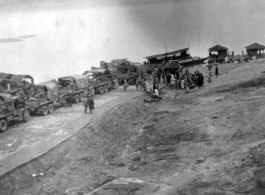 12th Air Service Group convoy waiting to cross barge in China during WWII.