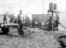 GIs bathing at Liuzhou from 55-gallon drums. During WWII.