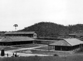 A set of buildings and covered walkway at an American base in China during WWII.