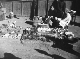 Wares laid out by a roadside hardware vendor in China during WWII.