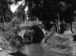 A small arched stone bridge near Kunming. During WWII.