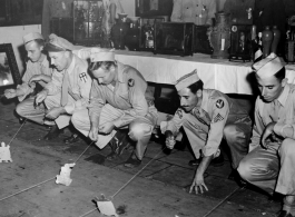 Recreation: GIs do a tortoise and the hare race, possibly at a charity event. In China during WWII.