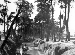 A boat on a canal in Yunnan province, China. During WWII.