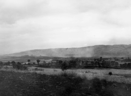 An American transport plane over a base in China during WWII, either Luliang or Yangkai.