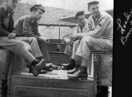 Servicemen out near the flight line"loading bombs" in SW China during WWII, mostly likely in Yunnan.