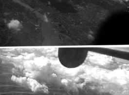 Aerial view of B-25s over a city--possibly a bombing target--likely over French Indochina (Vietnam) or SW China. During WWII.