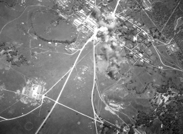 Bombing of small crossroads town, either in Burma or French Indochina. During WWII.