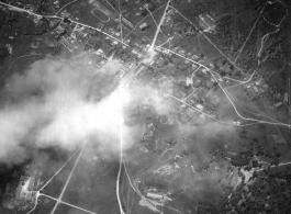 Bombing of small crossroads town, either in Burma or French Indochina. During WWII.