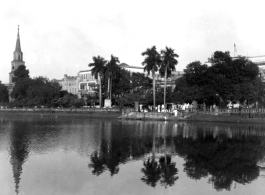 Buildings on waterfront.  Scenes in India witnessed by American GIs during WWII. For many Americans of that era, with their limited experience traveling, the everyday sights and sounds overseas were new, intriguing, and photo worthy.