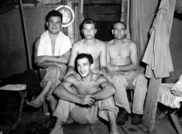 Engineers of the 797th Engineer Forestry Company pose in their barracks in Burma.  During WWII.