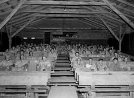 GIs of the 797th Engineer Forestry Company in Burma, watching a movie in the jungle.  During WWII.