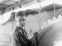 GI of the 797th Engineer Forestry Company in Burma, fixing saw blade in mill.  During WWII.