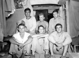 Engineers of the 797th Engineer Forestry Company pose in their barracks in Burma.  During WWII.